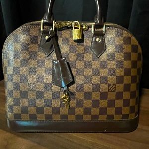 Authentic Louis Vuitton Alma PM Damier Ebene with lock and keys